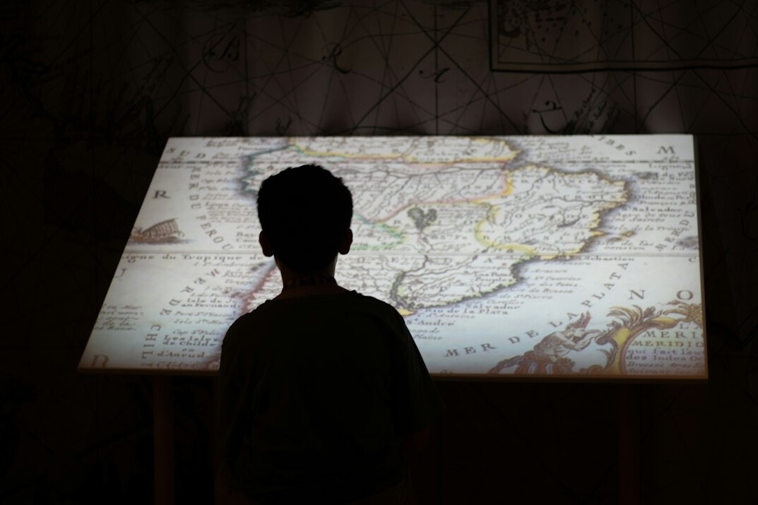 detective examining old map
